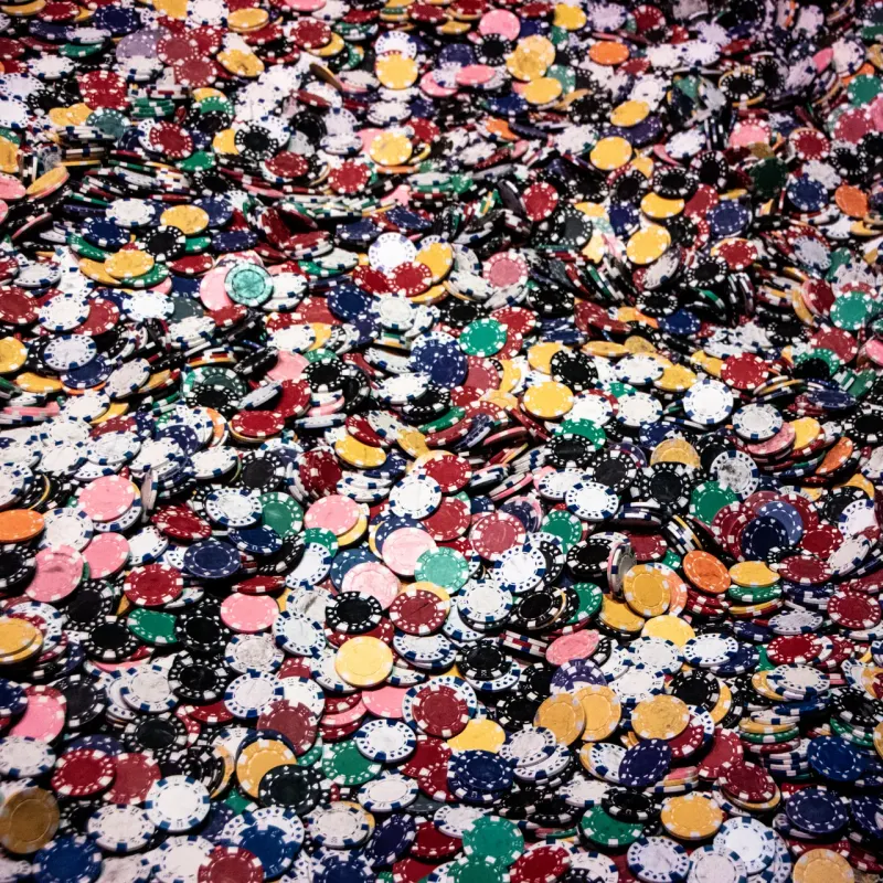 Large heap of multicoloured casino chips